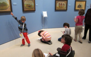 young kids sketching in museum gallery