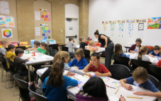 a classroom of students coloring