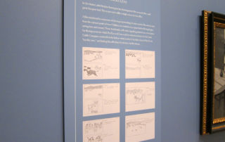 text panel in museum showing copies of drawings