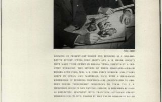 two men looking at paper while one man draws