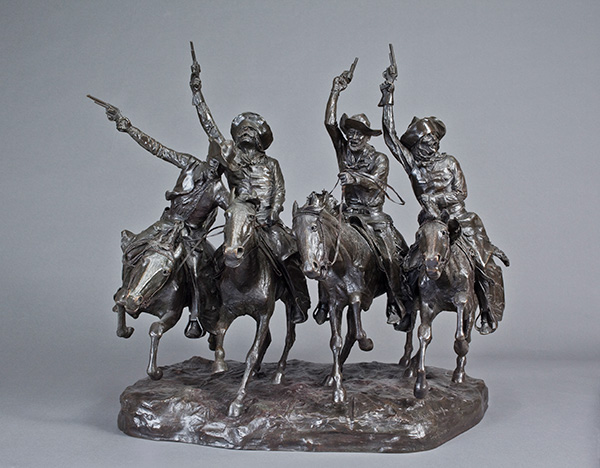 a group of four rowdy mounted cowboys pointing their pistols into the air