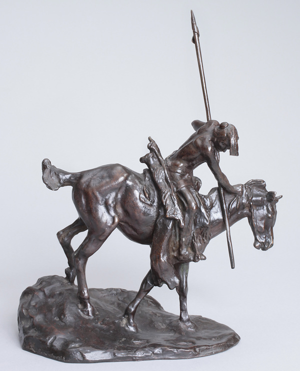 bronze of a mounted American Indian holding a spear, bent forward, looking toward the ground