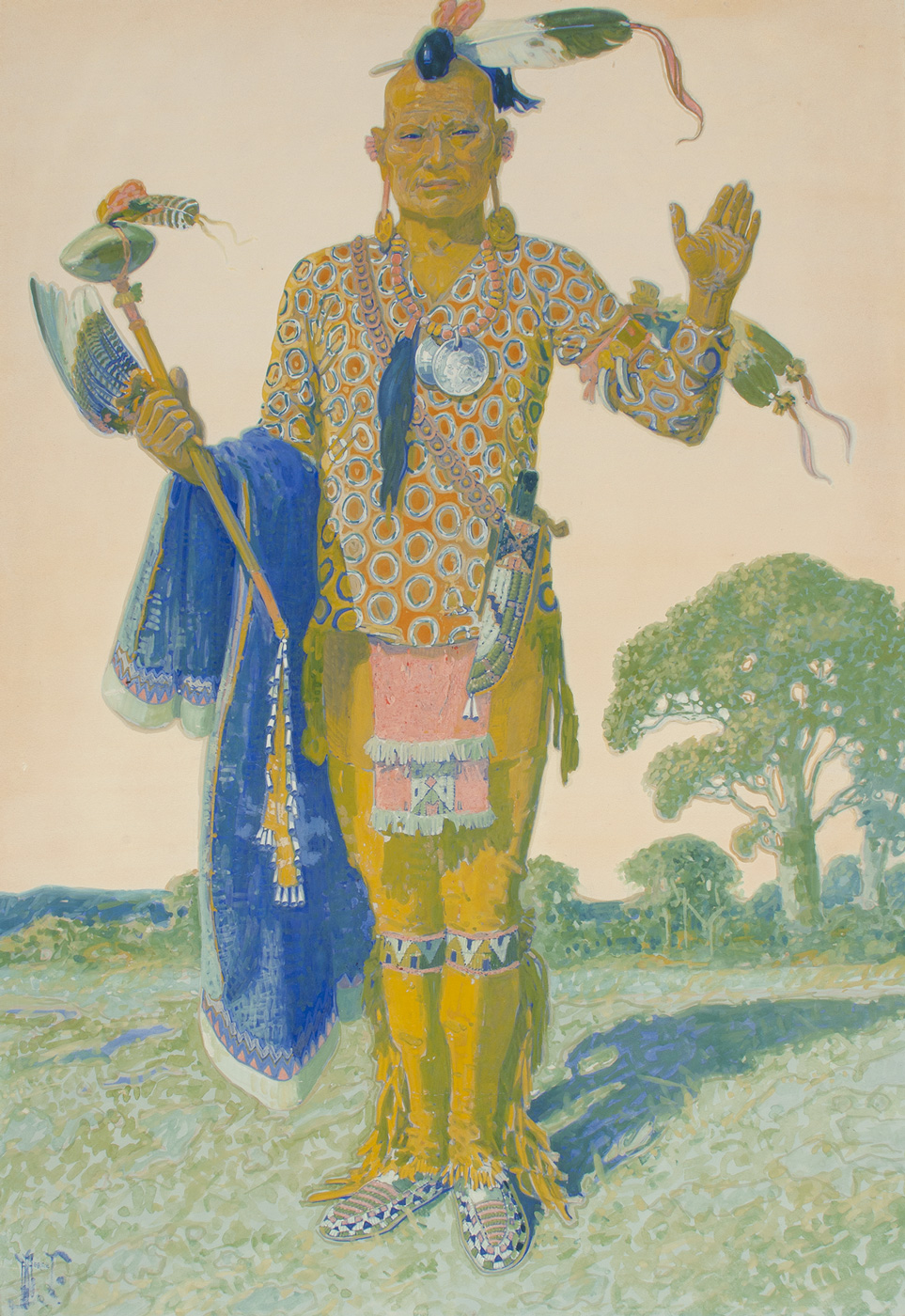 A full length portrait of a standing Apache man in tribal clothing.