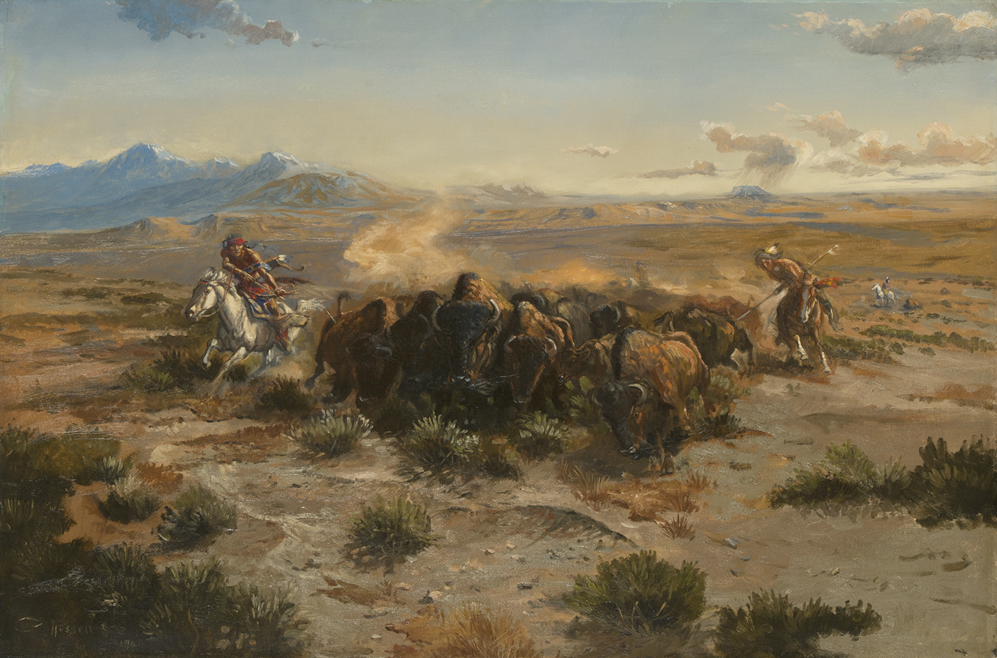 A herd of bison run forward while two indigenous American men on horseback flank them.