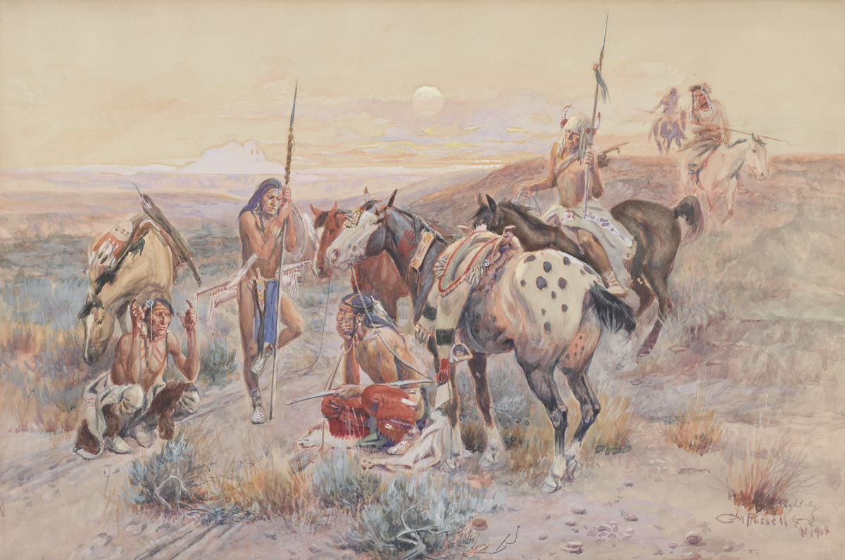 A group of indigenous American men with horses gather around linear tracks on the ground.