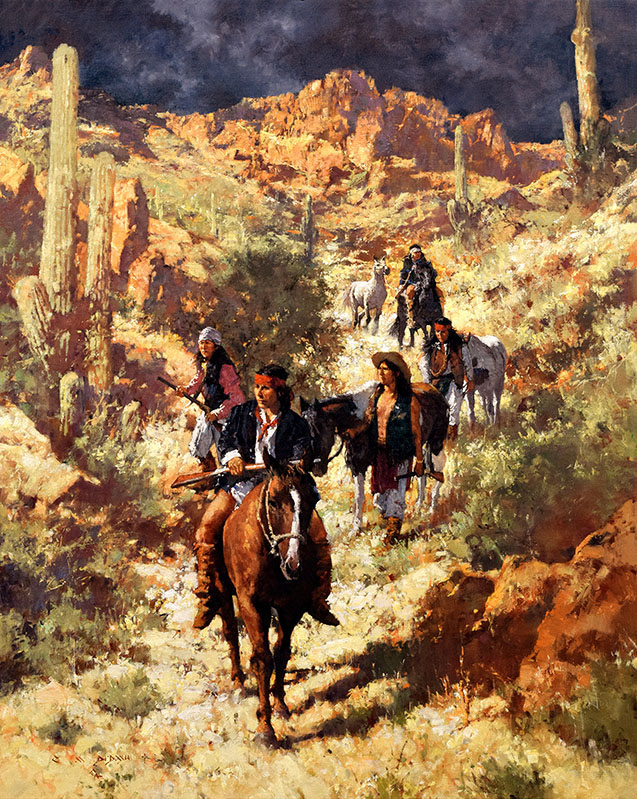 Group of Native Americans dressed in Western-style cloths riding and walking horses through a southwest landscape