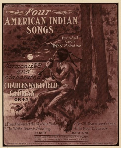 Sheet music cover with illustration of lone American Indian man playing a flute sitting under a tree in moonlight