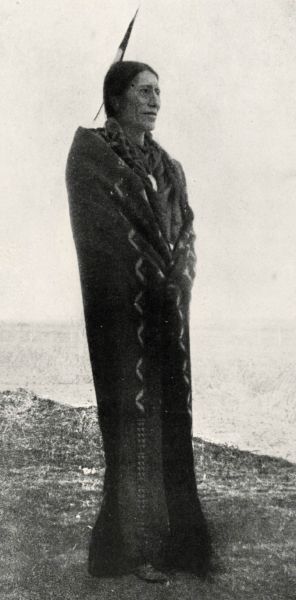 black & white photograph of American Indian man standing