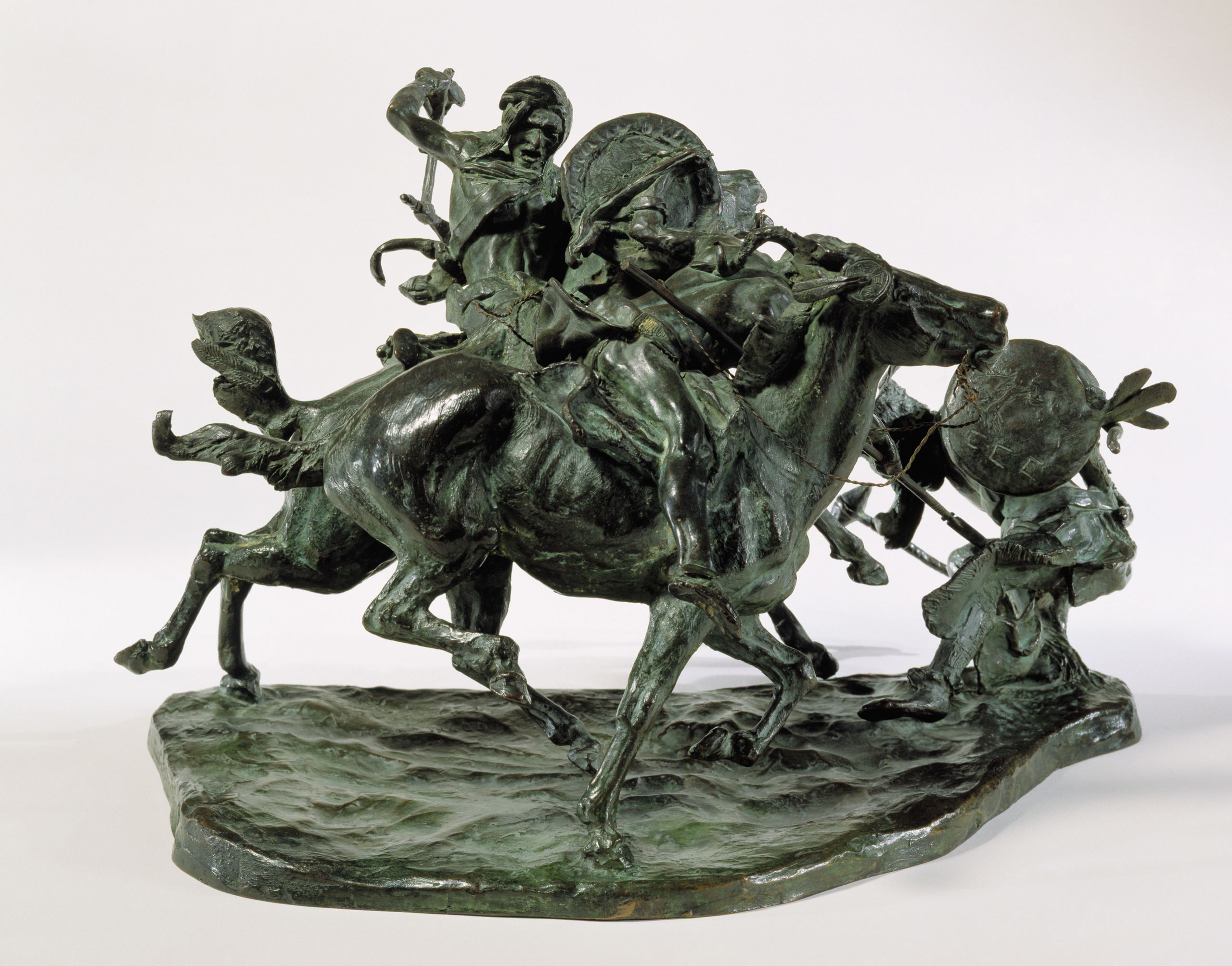 bronze sculpture of American Indians fighting each other