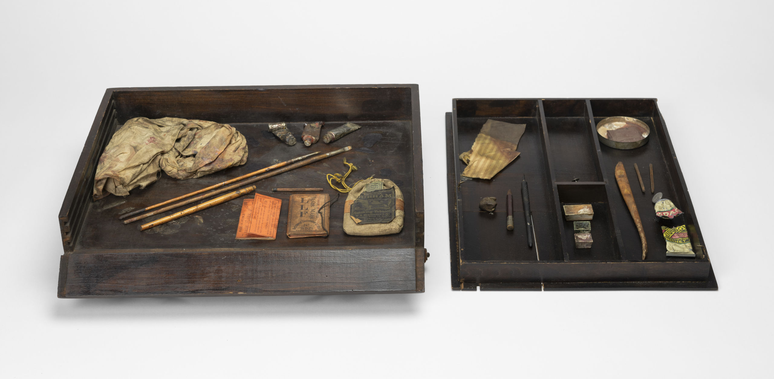 artist's sketch box with art tools and other supplies