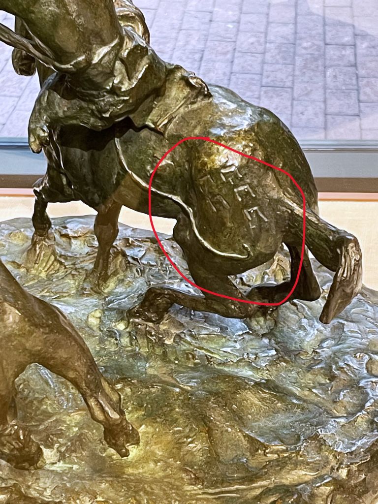 detail of horse in bronze sculpture