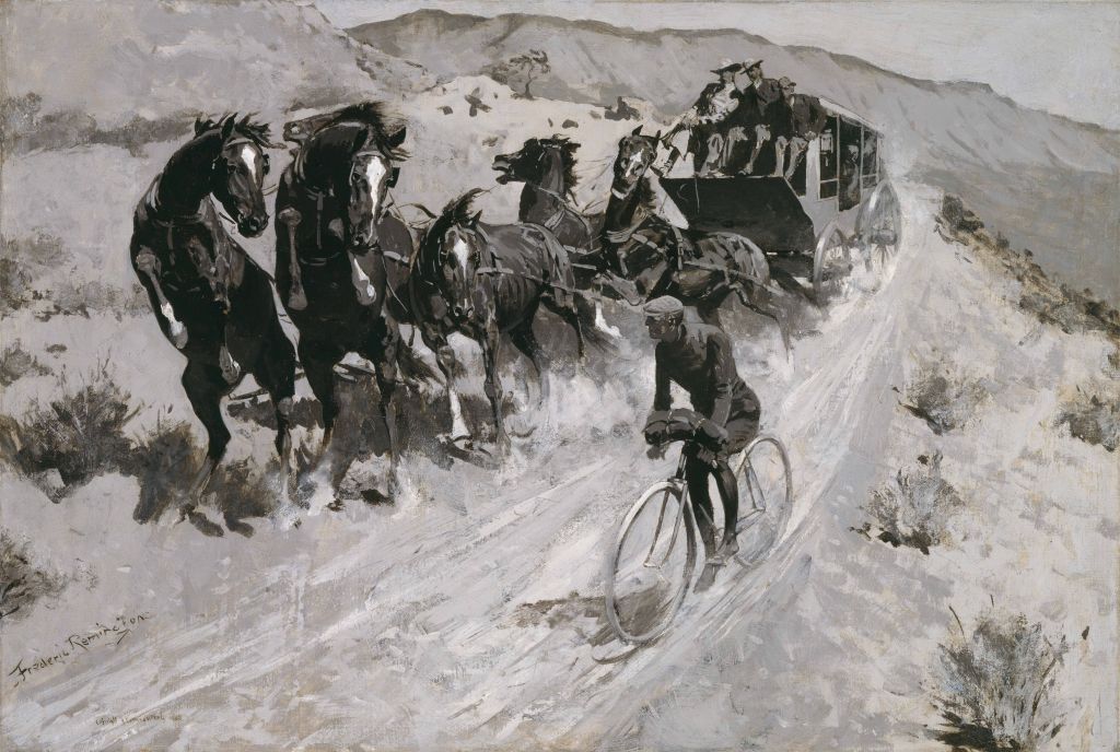 A bicyclists frightens a pack of horses connected to a stagecoach as he rides by.