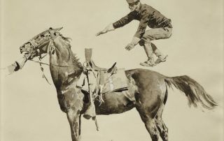 A soldier jumping onto the back of a horse.