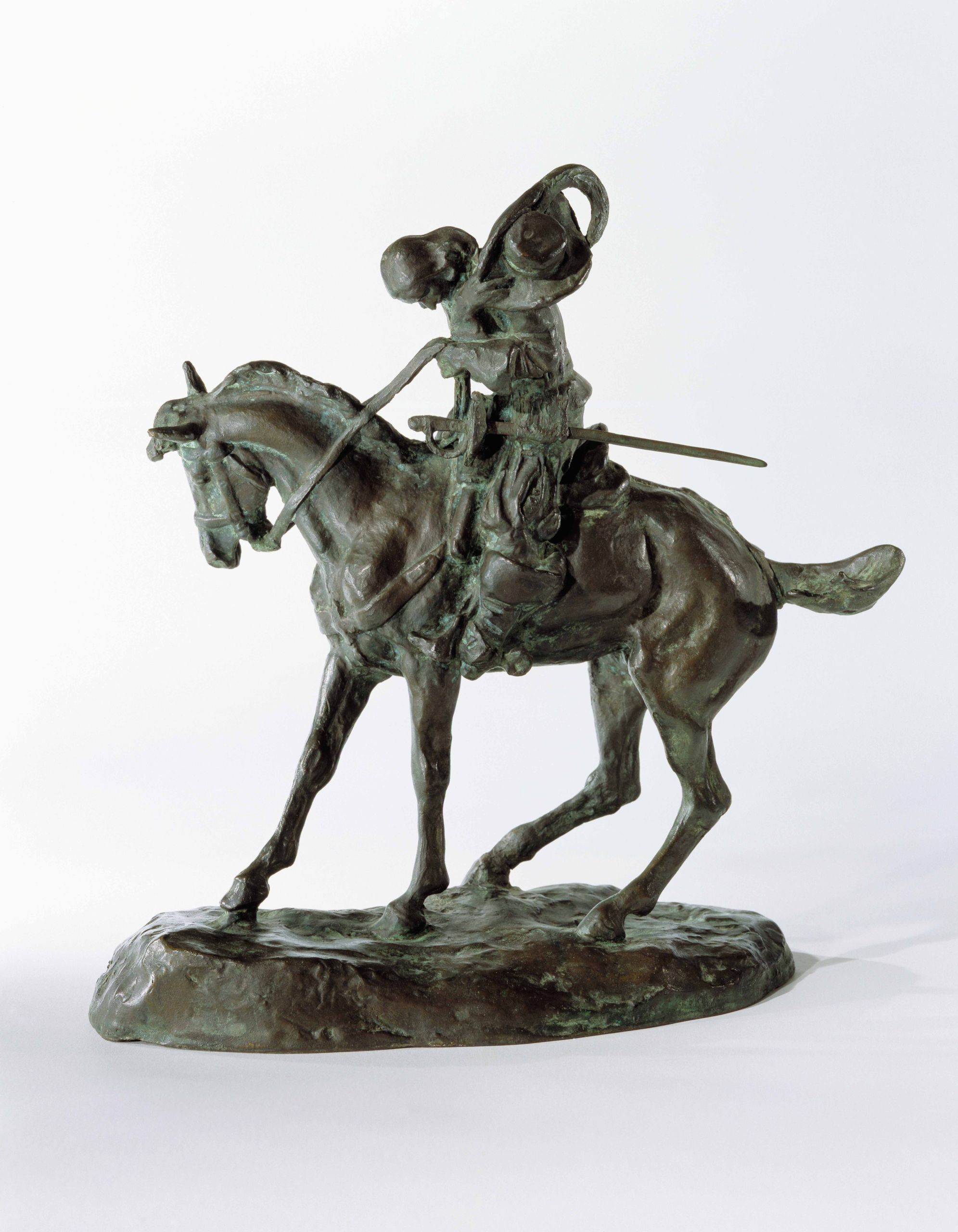bronze sculpture of a man riding a horse